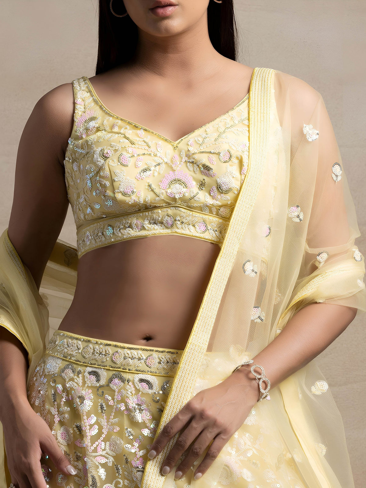 Pastel Yellow  Soft Net Sequins Embroidered Lehenga Choli