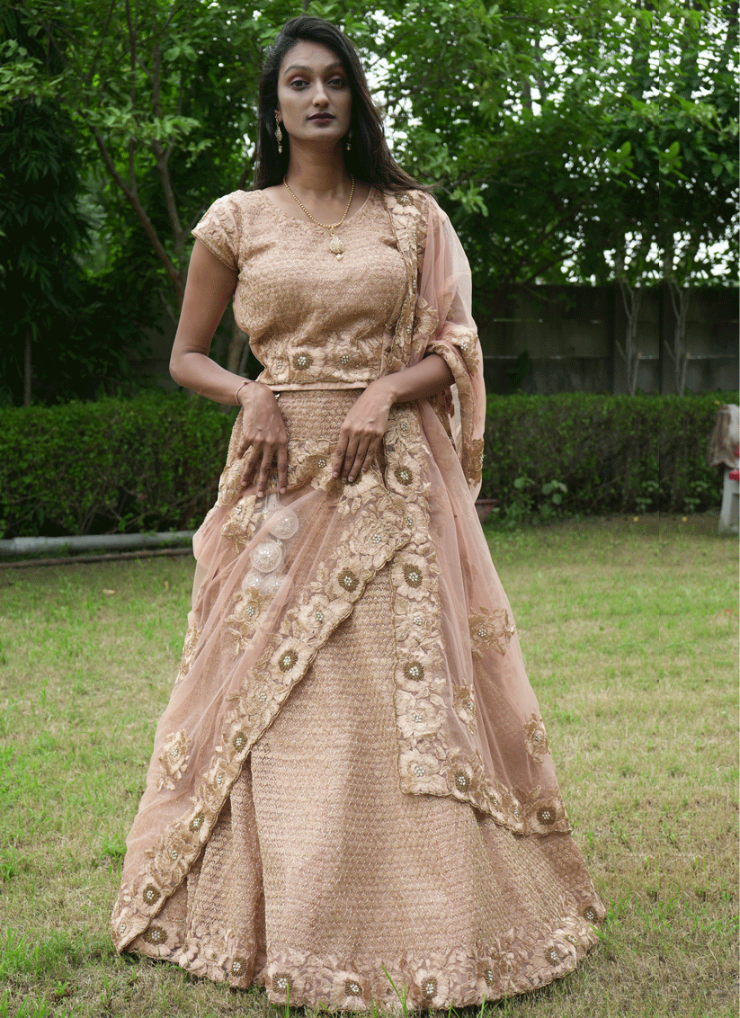 Peach Net Heavy Embellished Designer Lehenga Choli