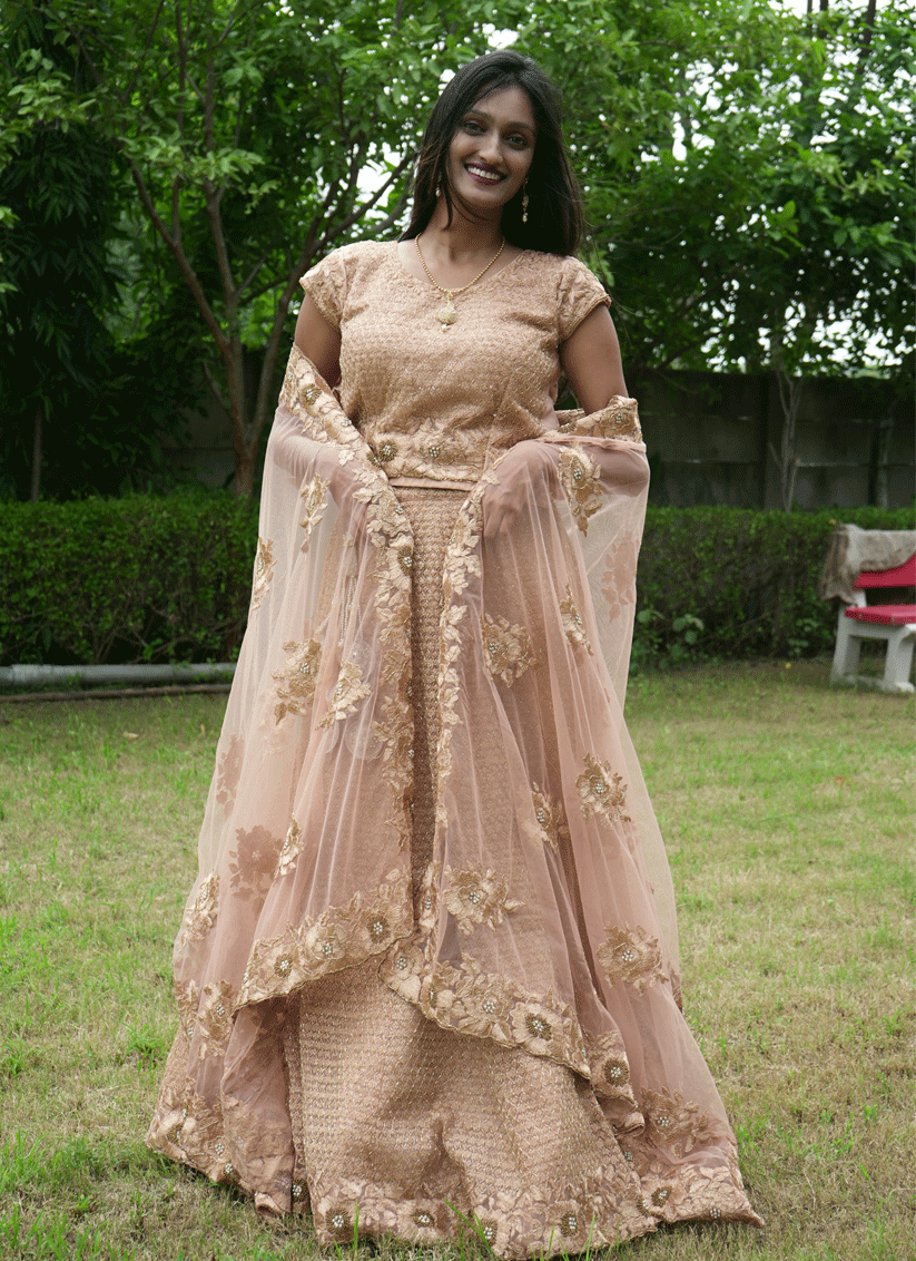 Peach Net Heavy Embellished Designer Lehenga Choli