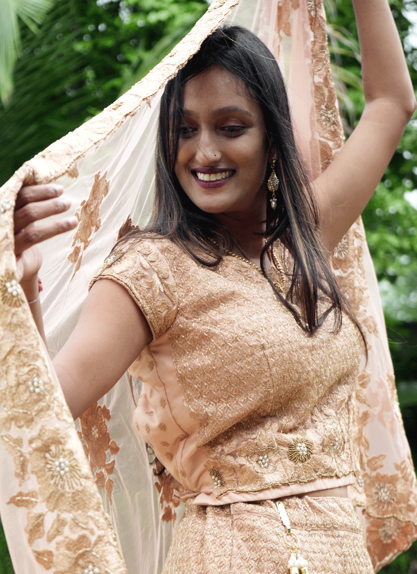 Peach Net Heavy Embellished Designer Lehenga Choli