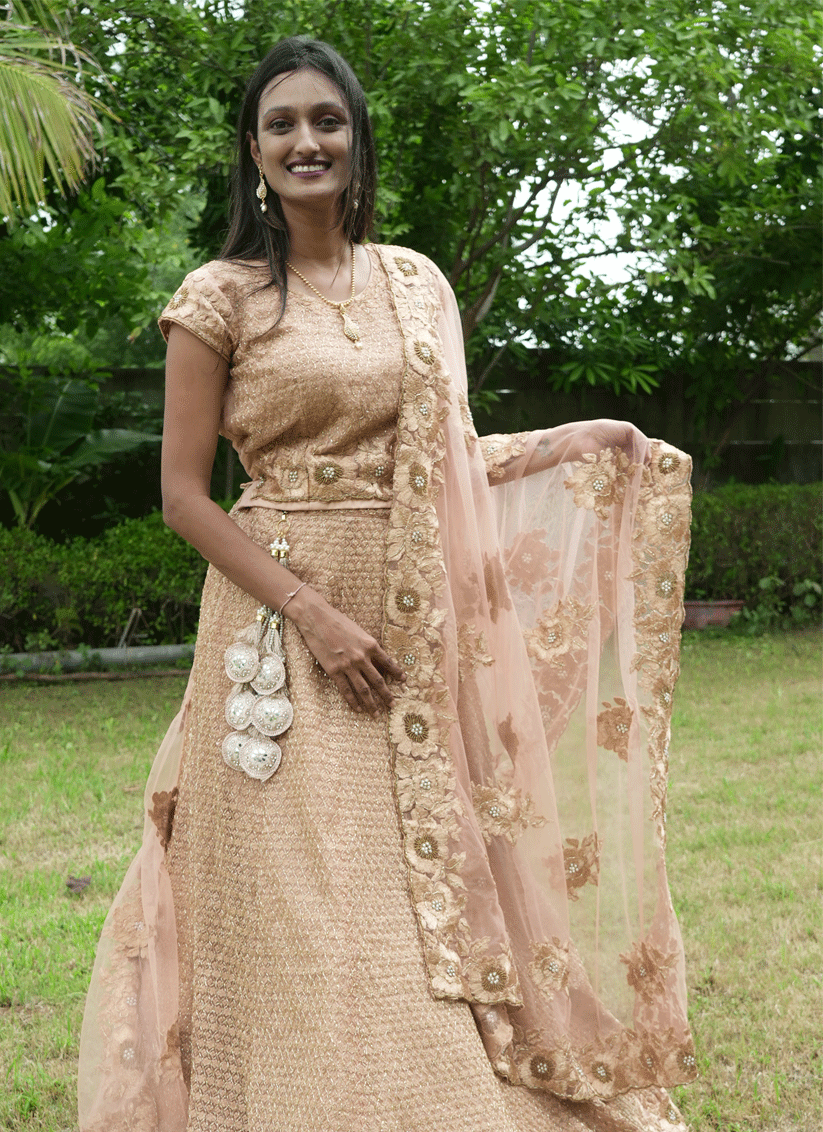 Peach Net Heavy Embellished Designer Lehenga Choli