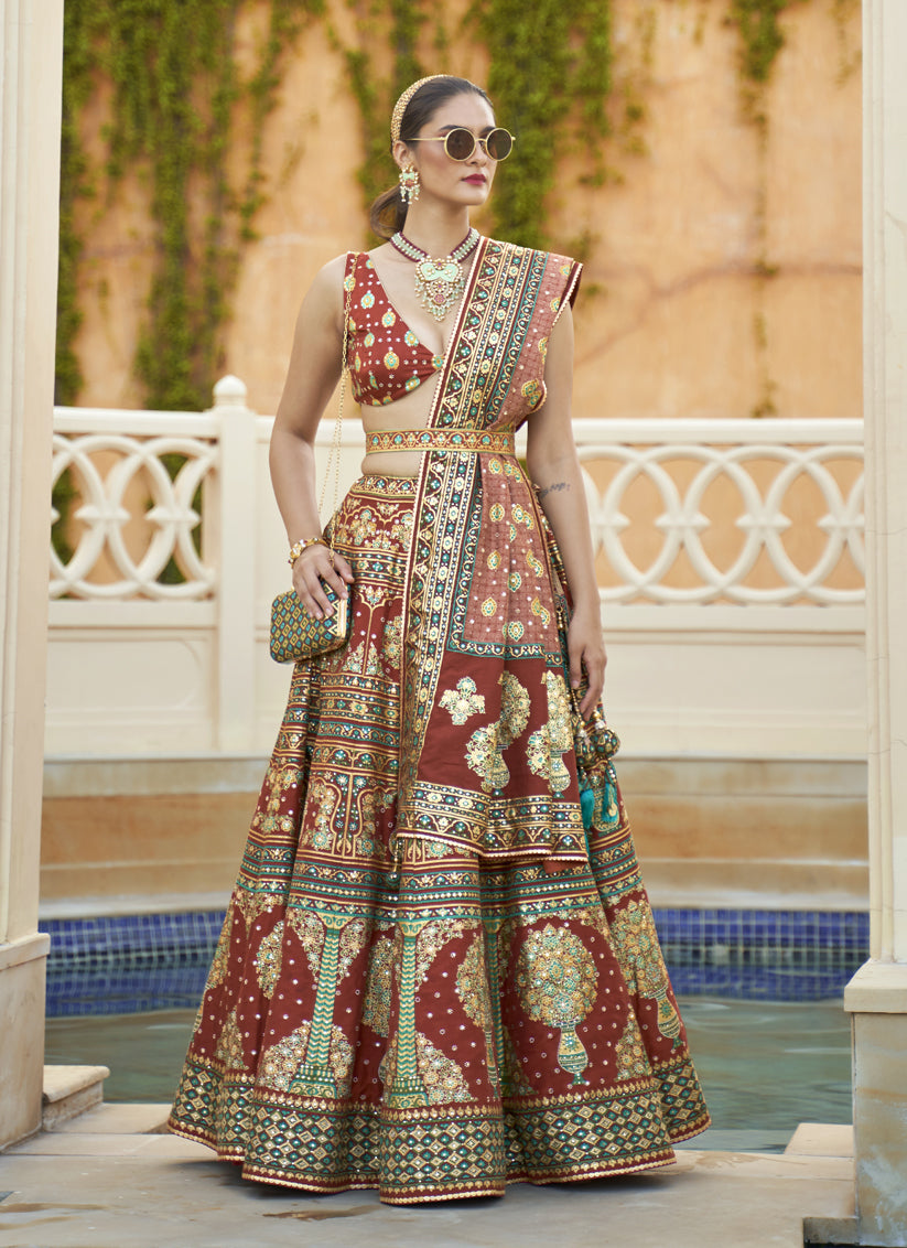 Rust Maroon Rajwadi Silk Embellished Lehenga Choli