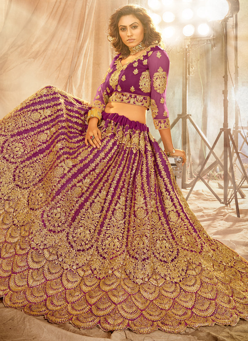 Purple Net Heavy Embroidered Wedding Lehenga Choli