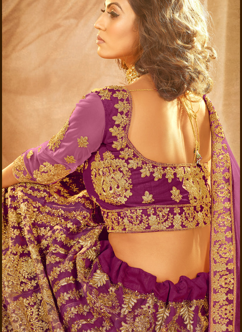 Purple Net Heavy Embroidered Wedding Lehenga Choli