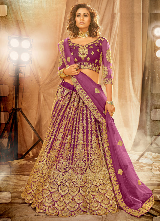 Purple Net Heavy Embroidered Wedding Lehenga Choli